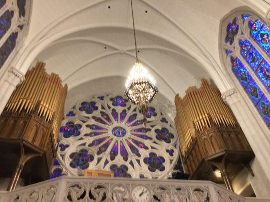 The organ pipes above the pews on the second level at St. James Chapel