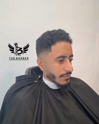 Low fade with a trim on top plus a beard line up