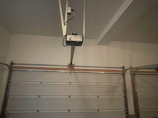 Garage door mechanism and electrical wires