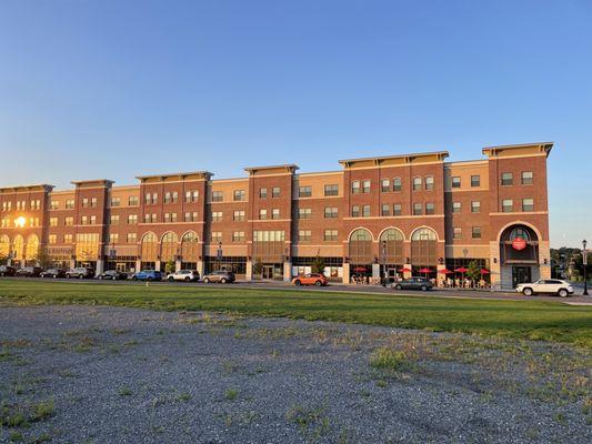 Front if the building from the parking lot at sunset