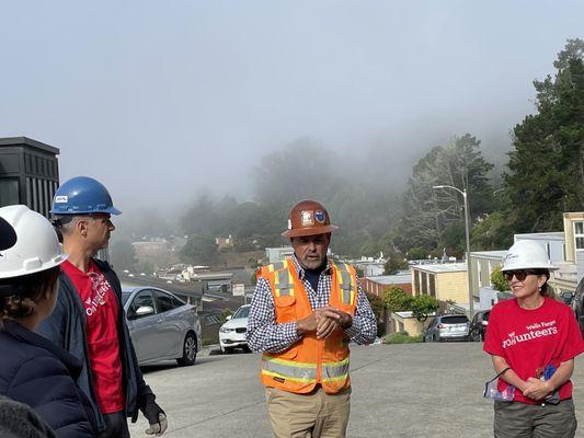 On the street, looking at the SF building site