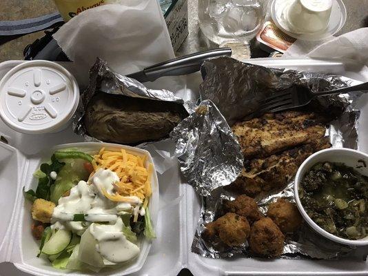 Blackened fish with salad, baked potato, hush puppies and greens. I also had a side of cole slaw.