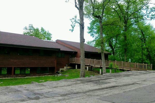 MPA East - 2702 International Lane, Suite 207. Photo shows the rear of the building, where there is a parking lot and a ramp to our suite.