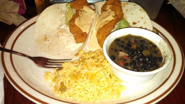 Fish tacos were good but too much sauce for me. The rice was very good and so were the black beans. My husband loved the wings!