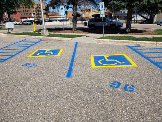 Accessibility logo, stripes and numbers for Downtown business parking lot in Fargo ND