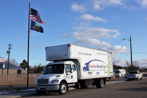 Our moving Truck next to our beautiful flag!