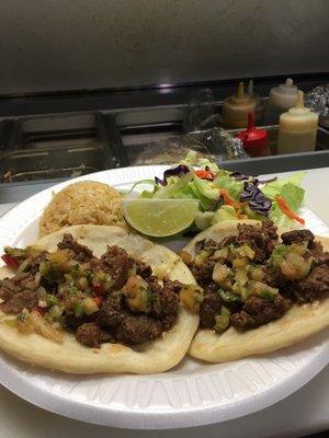 Beef Tacos on handmade tortillas with rice and house salad.