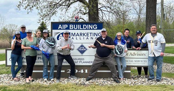 On the corner of John R and Square Lake, our employees pose by the company signage during 2024 Integrity Spring Training.