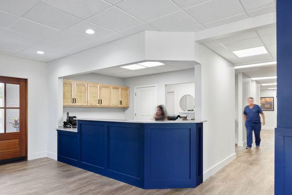 Front desk reception area and hallway leading  back to dental and hygiene operatories.