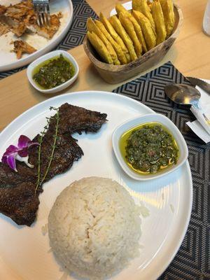 Steak, white rice, and a side of tostones (plantains)  Delicious