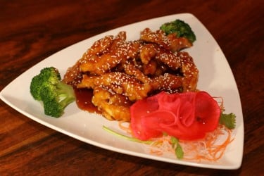 Sesame Chicken Strips of selected white meat chicken lightly battered and toss fried with our chef's special tangy sesame sauce