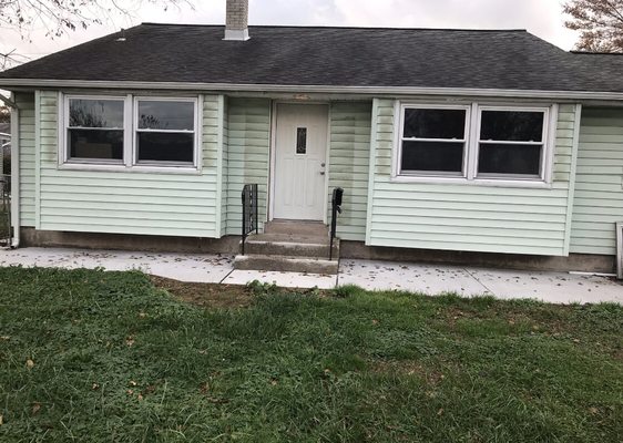 Photo of a house before we installed new siding.