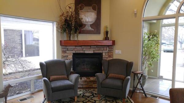 Warm and comfy sitting area by the fire at Boise Caring Dentistry.