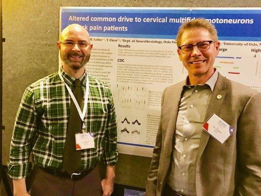 Dr. Baietti listening to Dr Tim Raven, D.C. from Norway explain his award winning research at DC2017 Spine/Health Conference in WashingtonDC