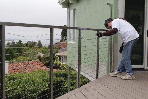 Tom, lead railing contractor and owner, installs railing system