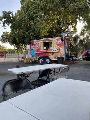 Food truck and tables to eat