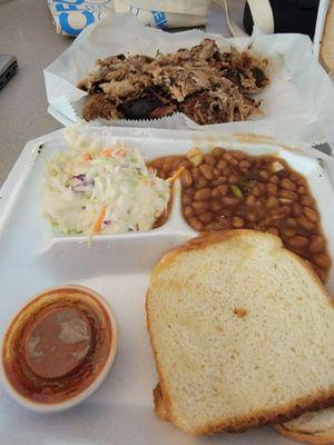 Pulled pork plate with cole slaw and beans.