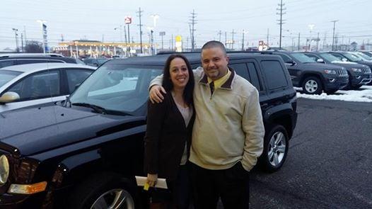 Another happy Spitzer Motor City customer with General Manager Geoff Sansavera.