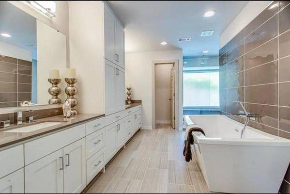 Lavish master bath features free standing soaking tub, dual sinks, oversized shower area.