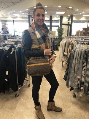 Manager Holly showing a recent Louis Vuitton consignment.