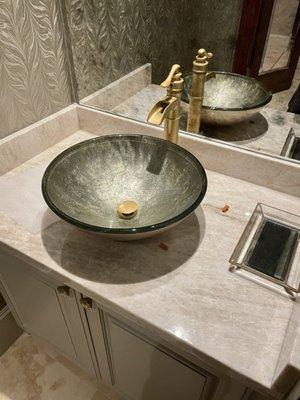 Vessel Sink with a gold  faucet