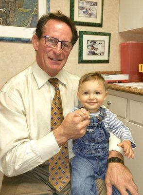 Dr. Reed with a child patient.