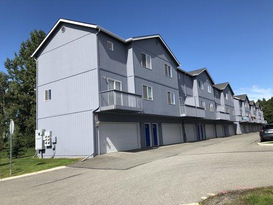 Chugach Meadows Townhomes - Luxury townhomes in a prime midtown location with manicured lawns and modern architectural elements.