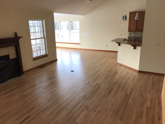 Hardwood floors recently sanded and finished with clear coats of polyurethane.