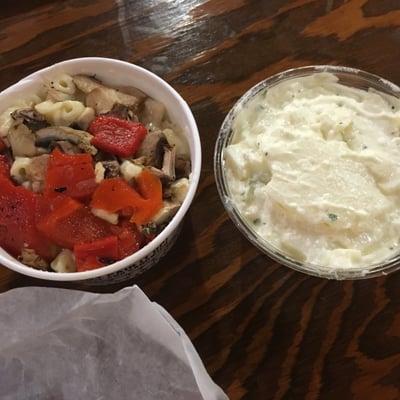 Mac n cheese topped w roasted red pepper & shrooms (left), potato salad.