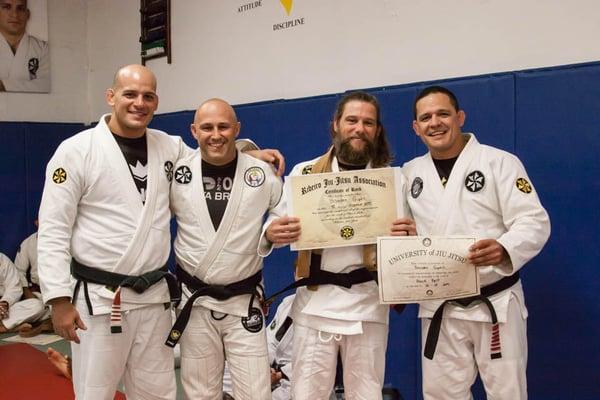 Branden Receiving his Black Belt with Shawn, Saulo and Xande.