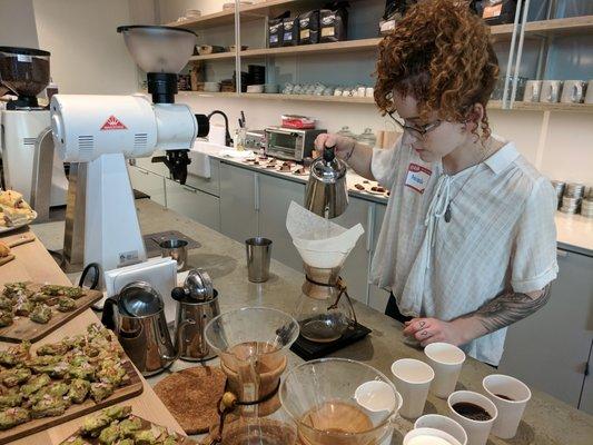 Amanda doing pour overs of decaf coffee using Chemex brewing.