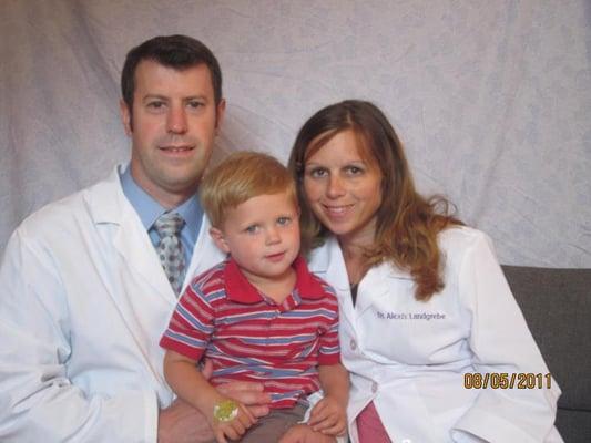 Dr. Charlie and Dr. Alexis with their son. This clinic is SO kid-friendly!