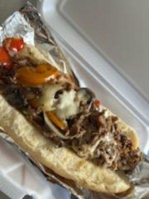 Philly steak and provolone cheese with onions and bell peppers