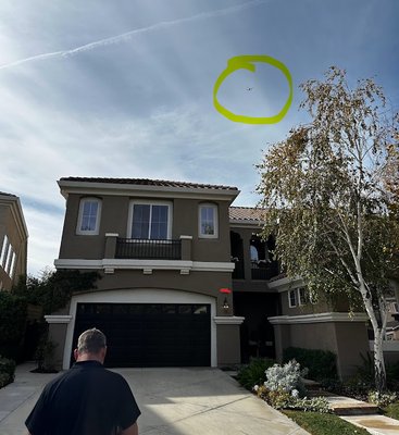 Jason from Capital Inspections flying his drone to survey the roof.