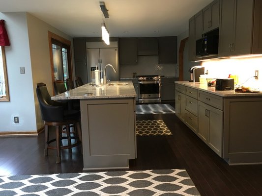 new cabinets, granite counter and tile back splash