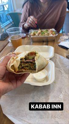 My Falafel wrap! In the back is my sisters Chicken Shawarma over rice.