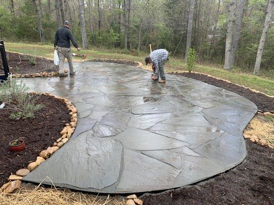 River rock border, mulch beds, flagstone patio