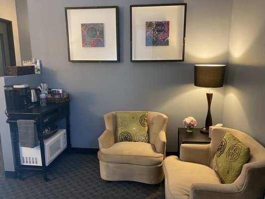 Our private waiting room with cozy chairs, a comfy couch, beverage cart and free WiFi is our new hang out spot!