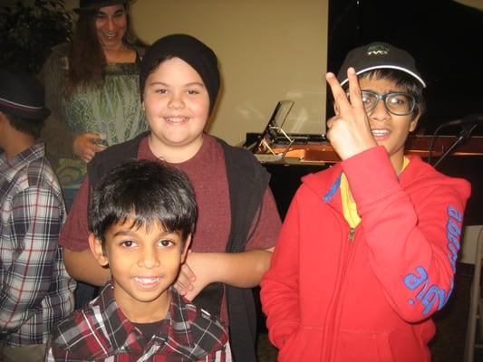 3 little guitar players with pro singer Hailna J in back!