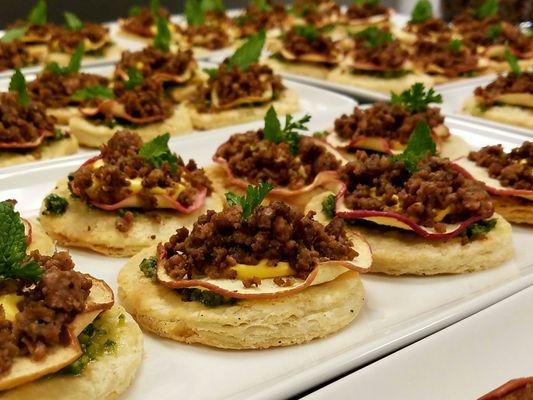 Lamb sausage tarts with apple and pesto