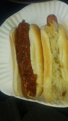 Hot sausage with onion and mustard and a hot dog with sauerkraut mustard