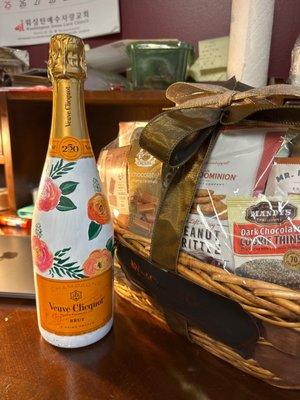 Personalized veuve cliquot with chocolate and cheese gift basket.