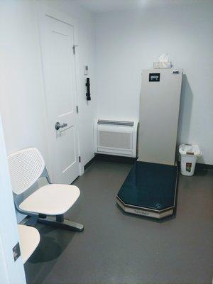 Our Modern Treatment room with our new exam table and scale.