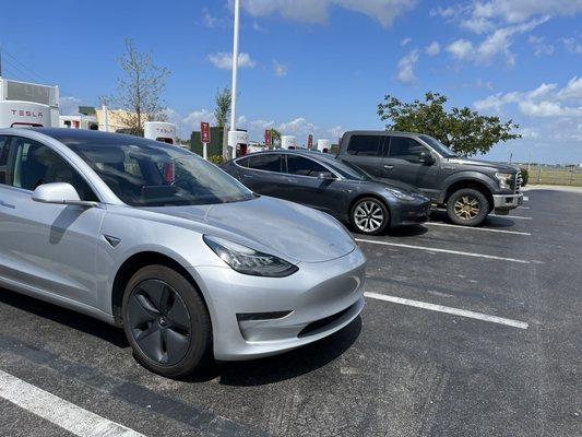 Tesla Supercharger Station, Punta Gorda, FL. Note the F150 icing one of the stalls.