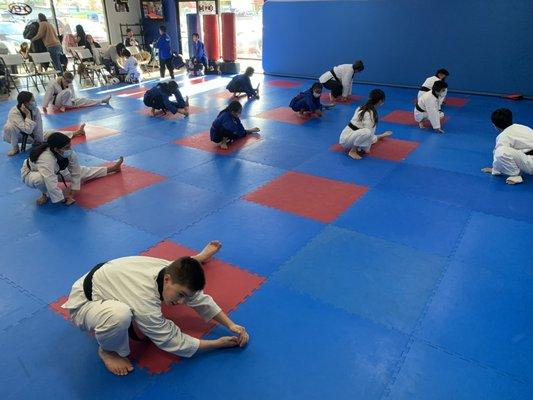 Black Belt Class warming up! Always stretching and improving!