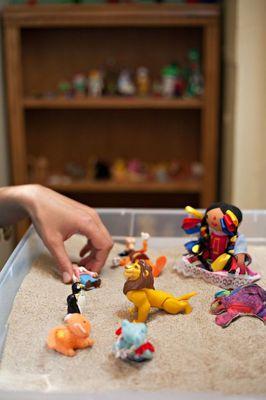 Adults & children both experience breakthroughs using sand play therapy.