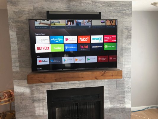 Sony TV on Tile over Fireplace with Sonos PlayBar