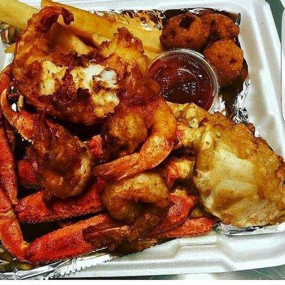 Fried snow crabs w/ lobster & Shrimp , fries , hush puppies