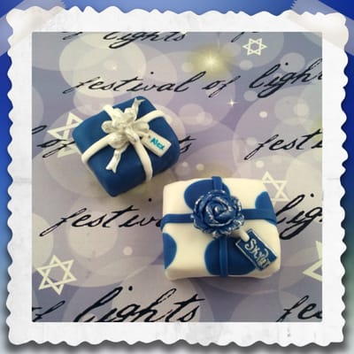 Fondant covered rice krispie treats.  A great sweet present for Hanukkah.