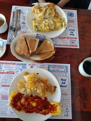 Spanish Omlette below and a Greek cheese Omlette above.